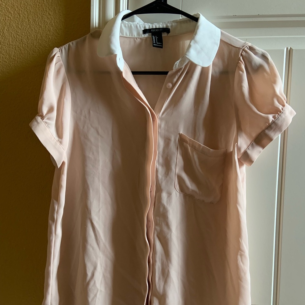 pink and white button down top with a collar